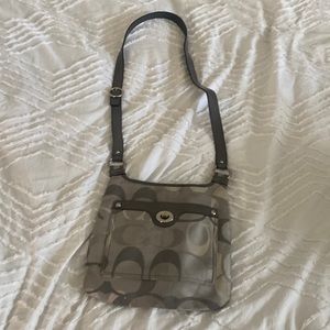 A grey coach purse